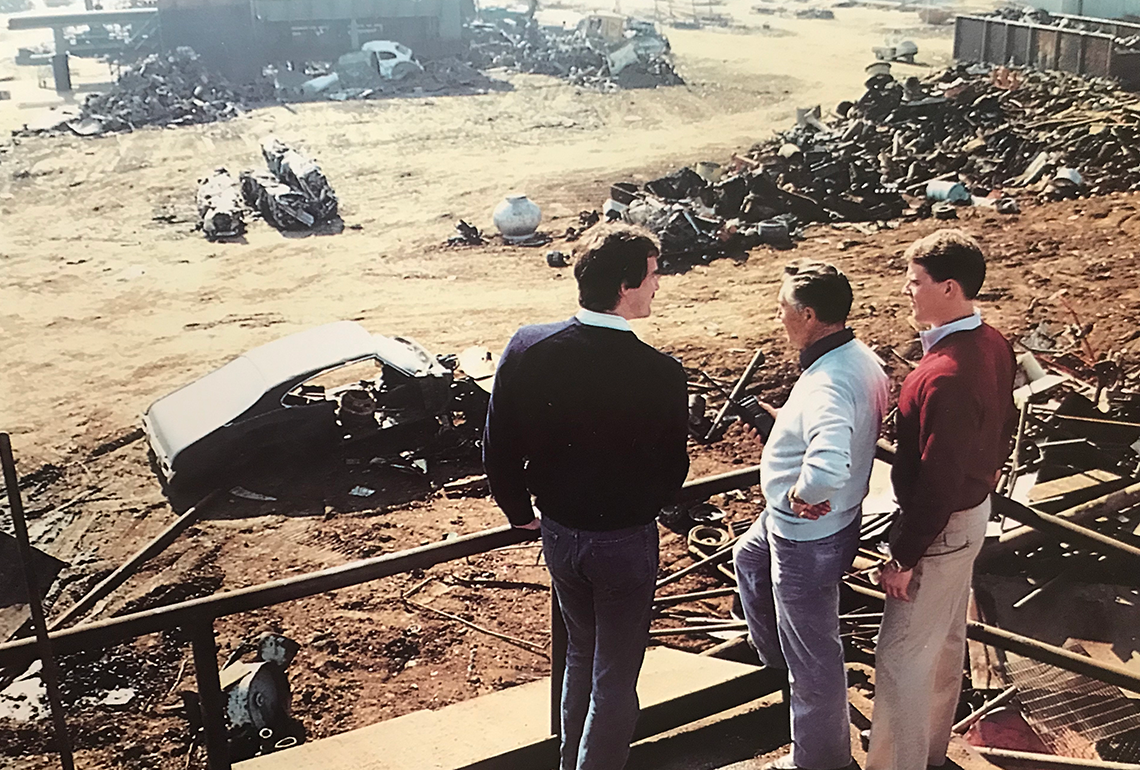 Sierra founder Ben Sacco and sons looking out at the scarp yard